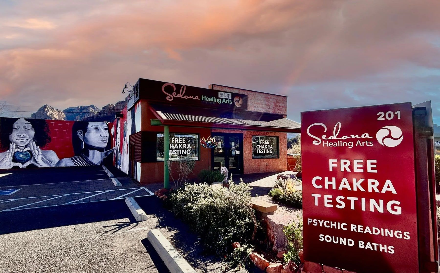 The Sedona Healing Arts shop at 201 AZ-179 in Sedona, with its red sign offering free chakra testing, psychic readings and sound baths